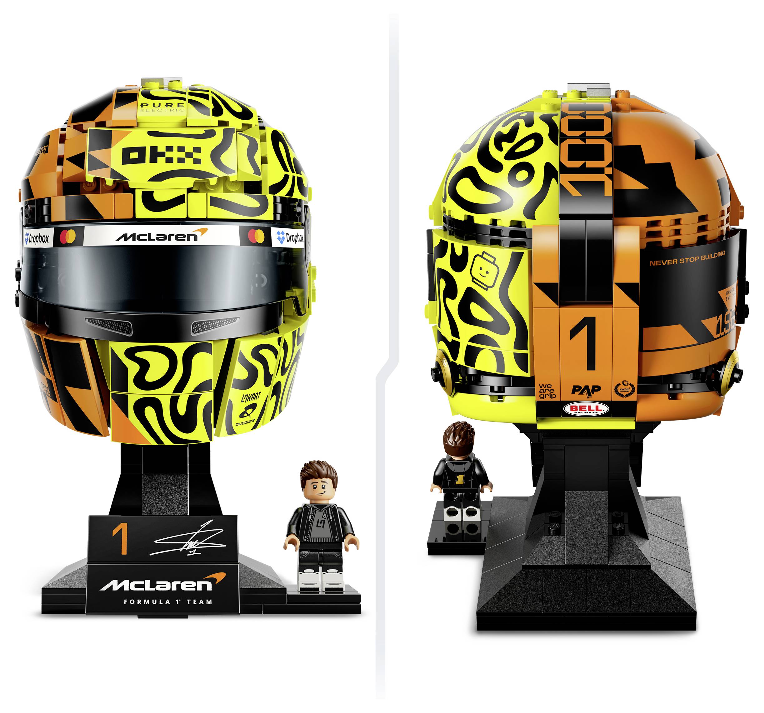 Vorder- und Rückansicht eines McLaren Formel-1-Helmmodells auf einem Ständer, mit beiliegender LEGO-ähnlicher Minifigur; schwarze, gelbe und orange Lackierung mit Nummer 1.