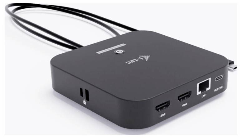 Ein rechteckiges schwarzes elektronisches Gerät mit mehreren Anschlüssen, darunter USB, HDMI, LAN und einen Ladeanschluss. Drei Kabel erstrecken sich von der Rückseite.