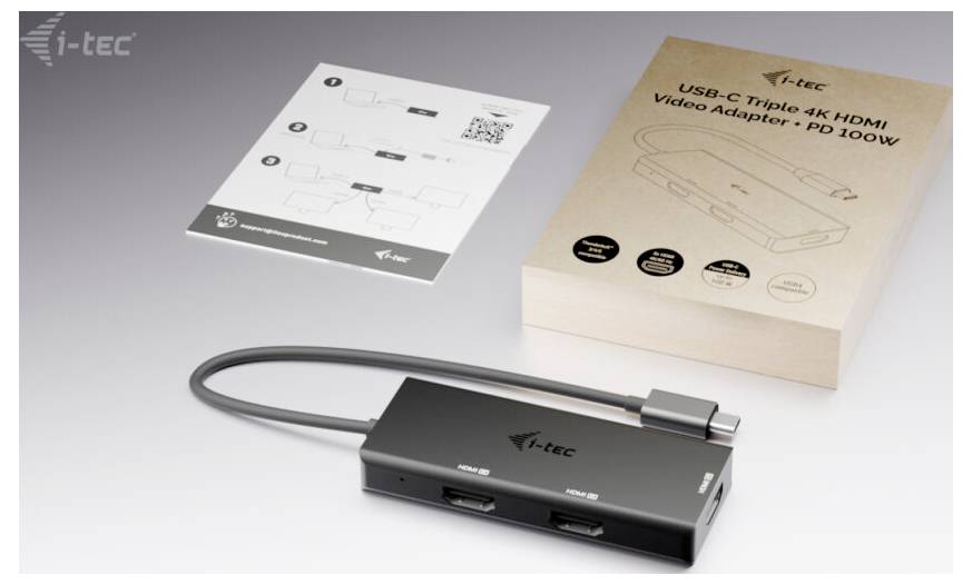 Ein USB-C-Triple-4K-HDMI-Videoadapter mit Kabel wird gezeigt, zusammen mit seiner Verpackung und einem Anleitungsblatt. Marke: i-tec.