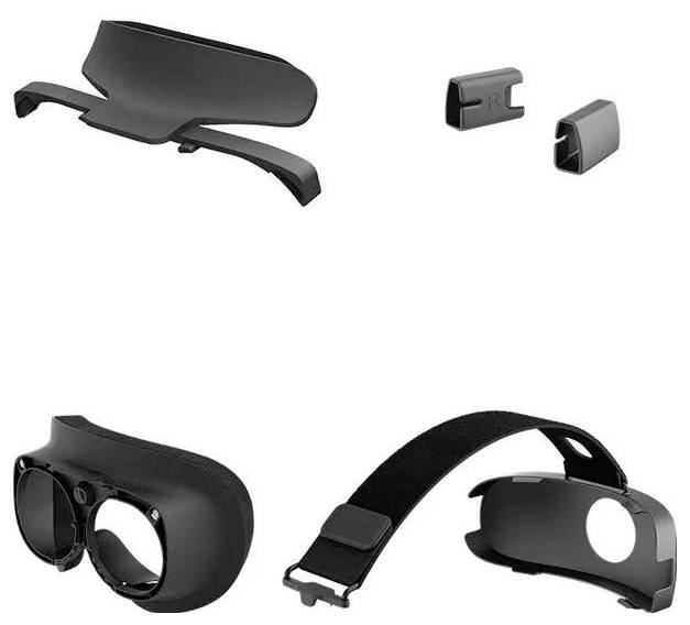 VR-Headset-Zubehör einschließlich eines Kopfbands, Linsenabdeckungen, einer Gesichtspolsterung und Clips vor weißem Hintergrund.
