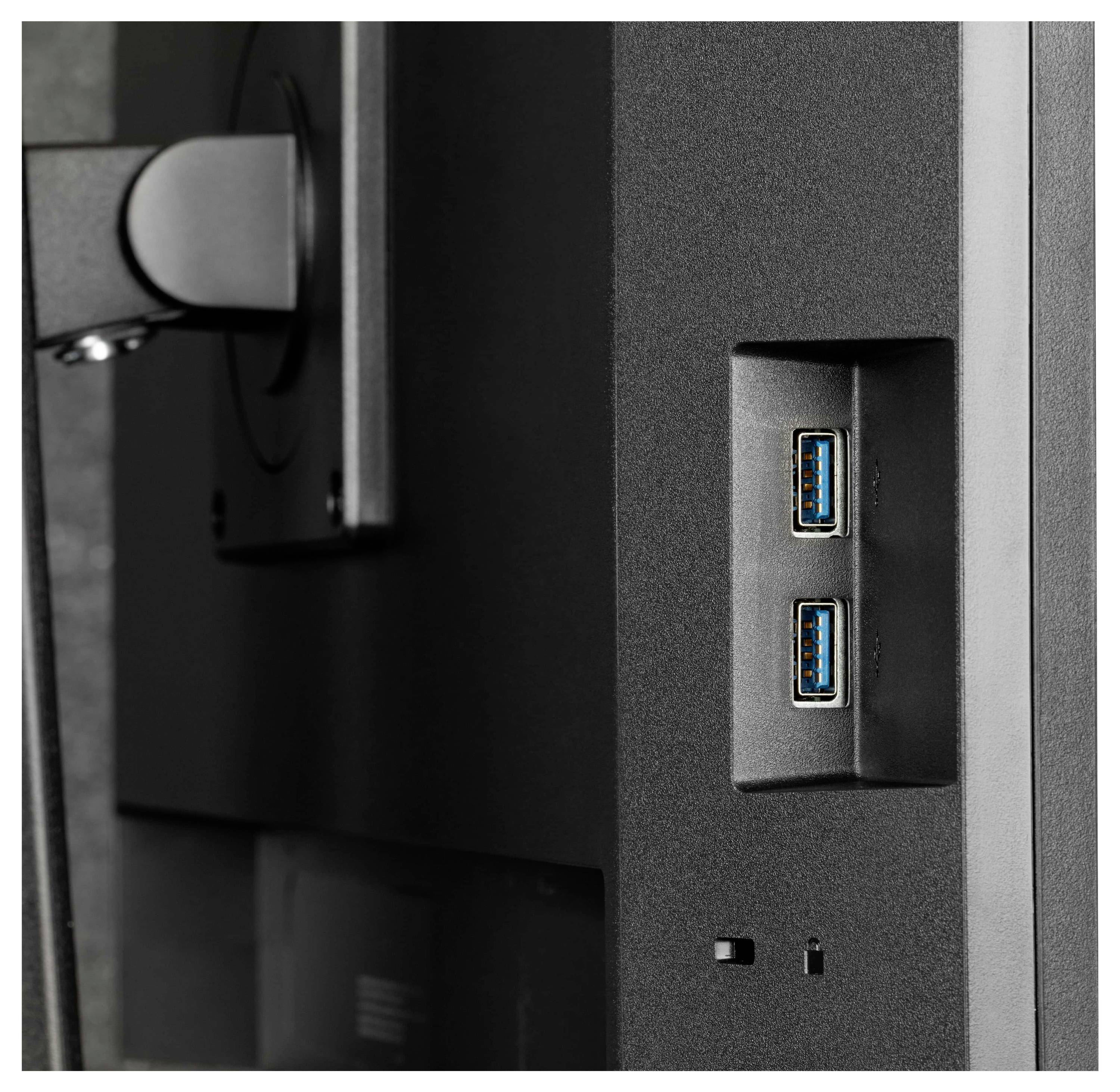 Seitenansicht eines Monitors mit zwei USB-Anschlüssen und Teil des Montagearms im Hintergrund sichtbar.