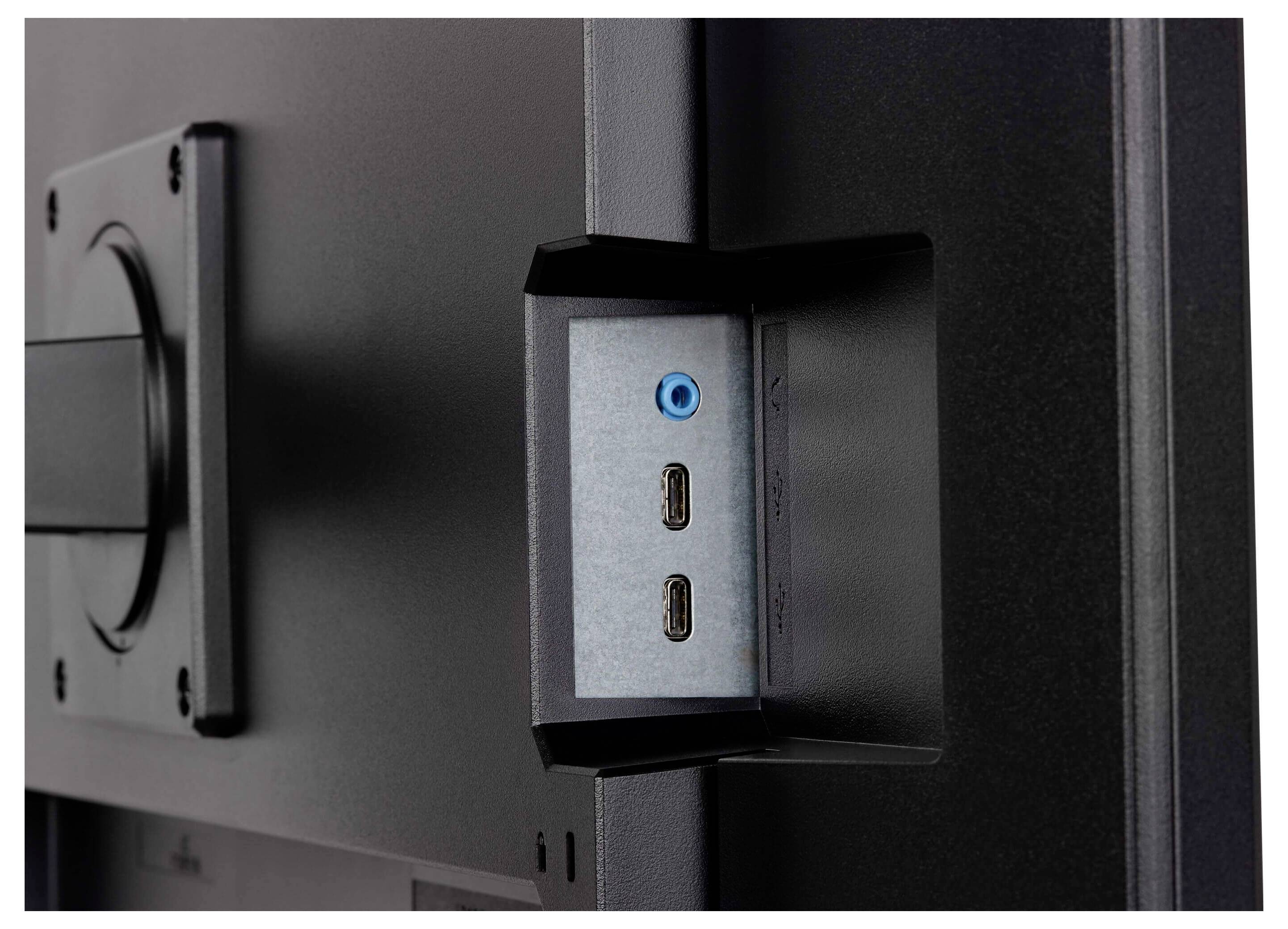 Anschlüsse an der Seite eines Computermonitors, darunter zwei USB-C-Anschlüsse und eine Audiobuchse.