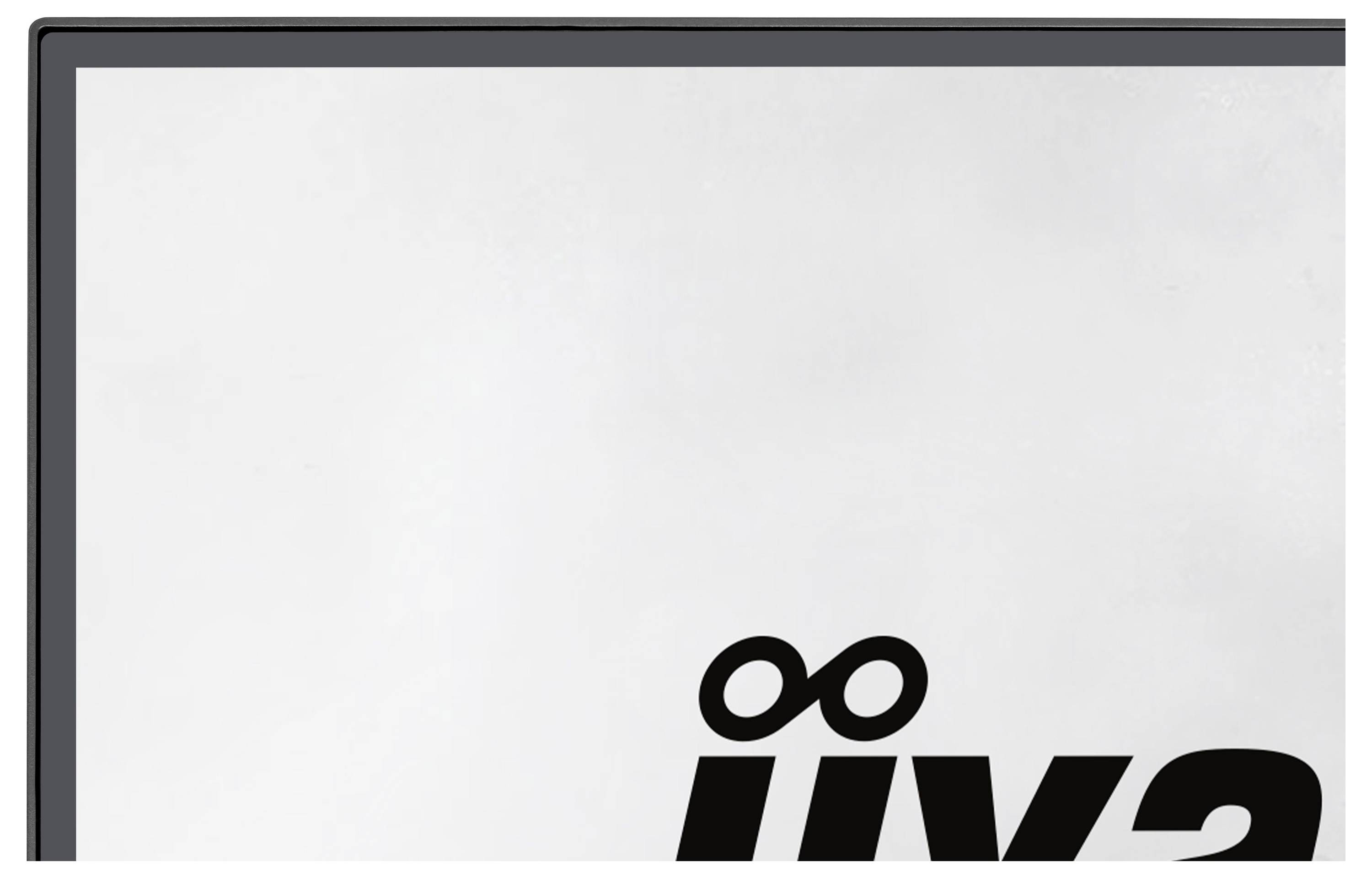 Eine Ecke eines schwarzgerahmten Objekts vor einfachem Hintergrund, mit teilweise sichtbarem, abstraktem schwarzem Text oder Symbolen in der Nähe des unteren Randes.