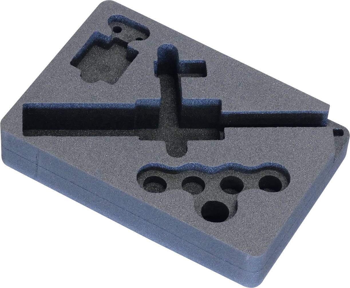 Schaumsoff-Einsatz mit benutzerdefinierten Aussparungen für Werkzeuge oder Ausrüstung, mit verschiedenen Formen und Tiefen zur sicheren Befestigung unterschiedlicher Gegenstände.