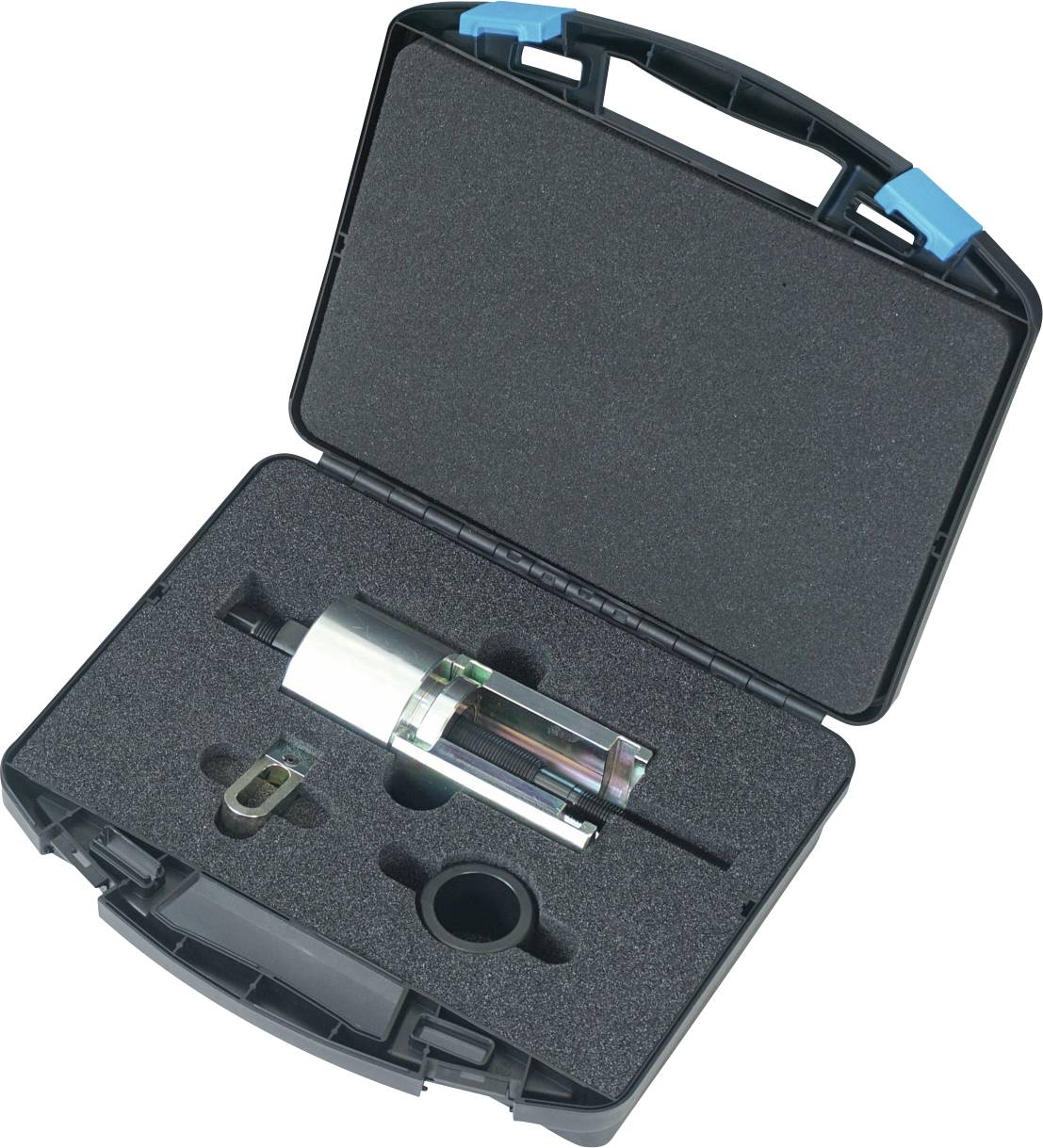 Das Bild zeigt einen offenen schwarzen Transportkoffer mit Schaumstoffpolsterung, der ein zylindrisches Metalltool und verschiedene Werkzeugkomponenten sicher an Ort und Stelle hält.