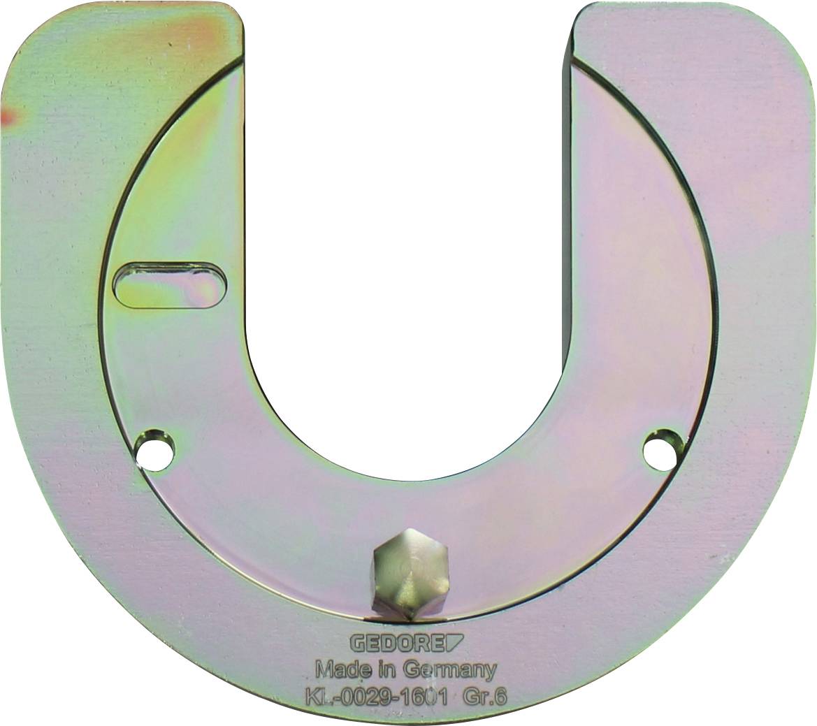 Ein U-förmiges, metallisches GEDORE-Werkzeug mit einer kleinen Buchse in der Mittelbodenfläche, gekennzeichnet mit „Made in Germany K1-0029-1601 Gr.S