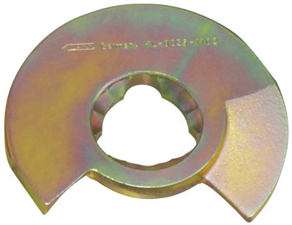 Ein kreisförmiges, metallisches Objekt mit einem zentralen Loch, das einem teilweise geschnittenen Zahnrad oder einer Unterlegscheibe ähnelt, weist eine gestempelte Reihe von Zahlen und Buchstaben auf.