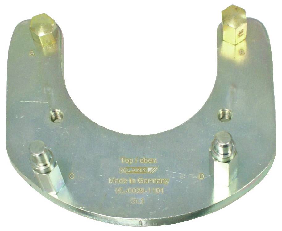 Ein metallisches, U-förmiges Werkzeug mit der Bezeichnung „Top/oben