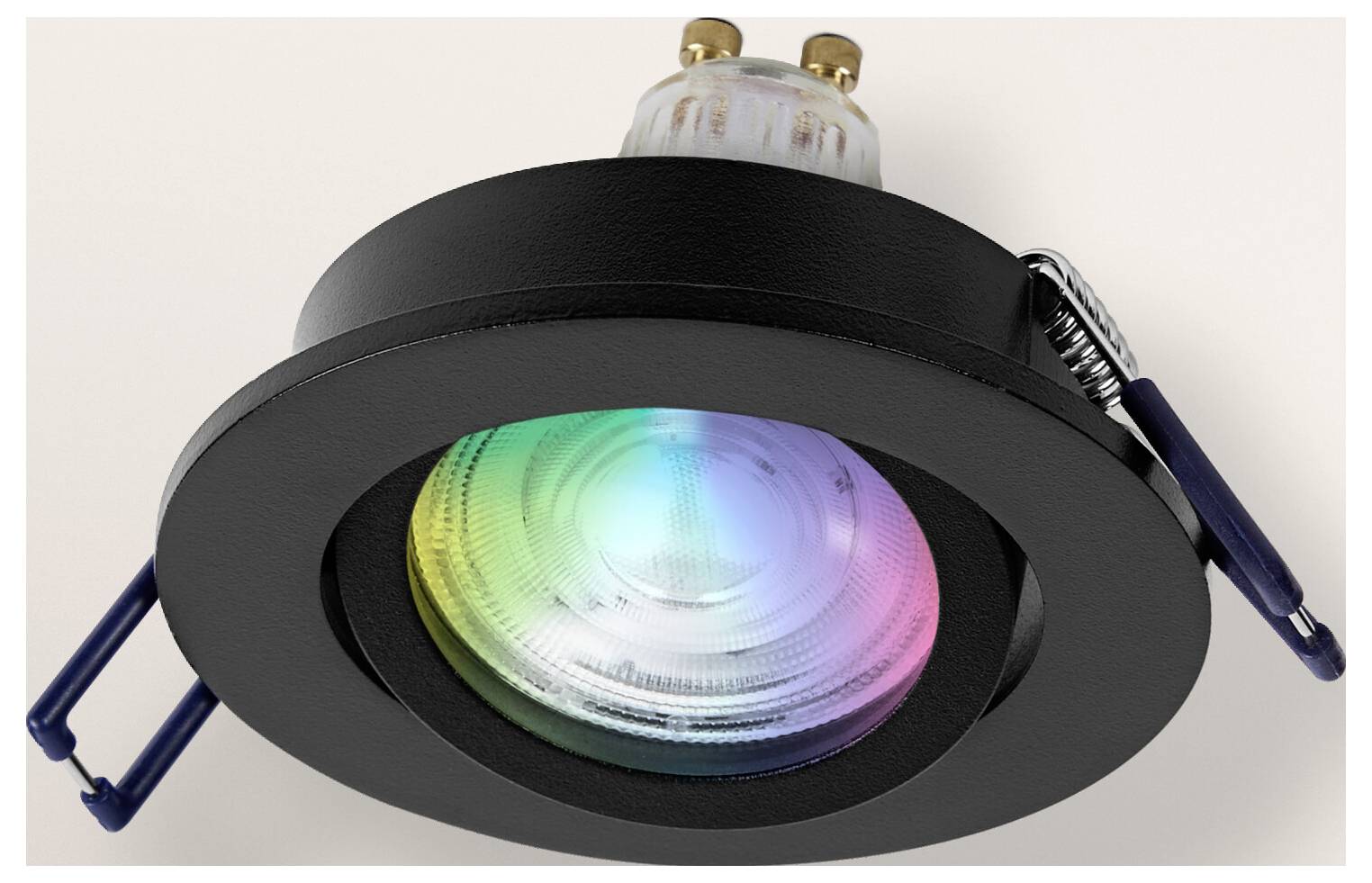 Eingelassene schwarze Leuchte mit einer mehrfarbigen LED-Glühbirne, die ein Farbspektrum mit Grün, Blau und Rosa zeigt.