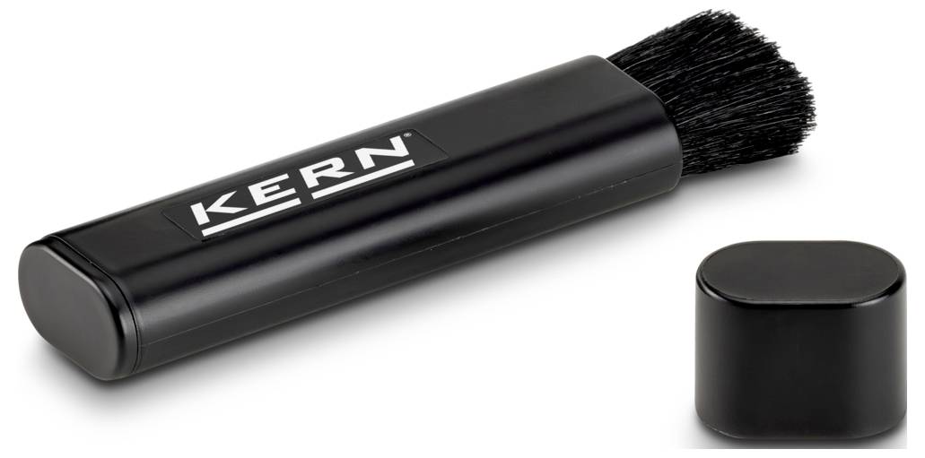 Ein quadratisches, weißes elektronisches Gerät mit einer geneigten Oberseite und einem USB-Typ-B-Anschluss an der Seite, möglicherweise zur Konnektivität verwendet.