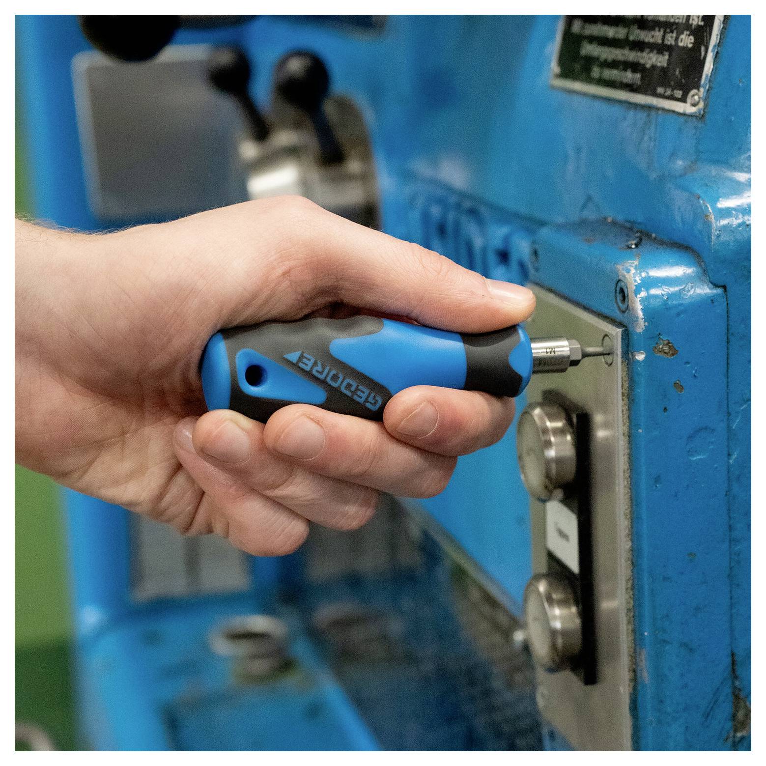 A blue and black ergonomic screwdriver with interchangeable bits labeled 'Gedore,' designed for comfortable grip and precision in tasks.