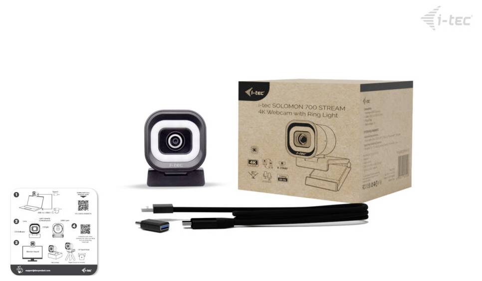 Eine Webcam mit Ringlicht, Produktverpackung, ein USB-Kabel und eine Bedienungsanleitung werden gezeigt. Das Markenlogo „i-tec