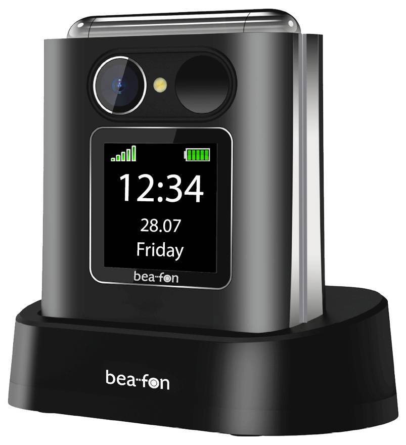 Ein schwarzes Klapptelefon auf einer Ladestation, das auf seinem Display „12:34