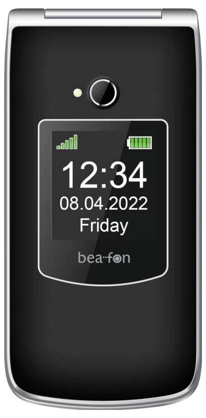 Ein schwarzes Klapptelefon wird angezeigt mit der Uhrzeit „12:34", dem Datum „08.04.2022" und dem Tag „Freitag". Signal- und Batteriesymbole werden als voll angezeigt.