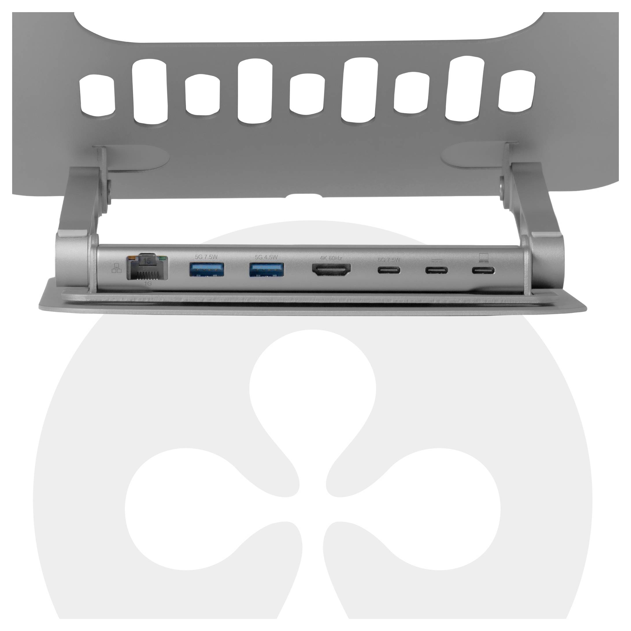 Nahaufnahme einer silbernen Dockingstation mit verschiedenen Anschlüssen, darunter Ethernet, USB, HDMI und USB-C, montiert unter einer gelochten Oberfläche.