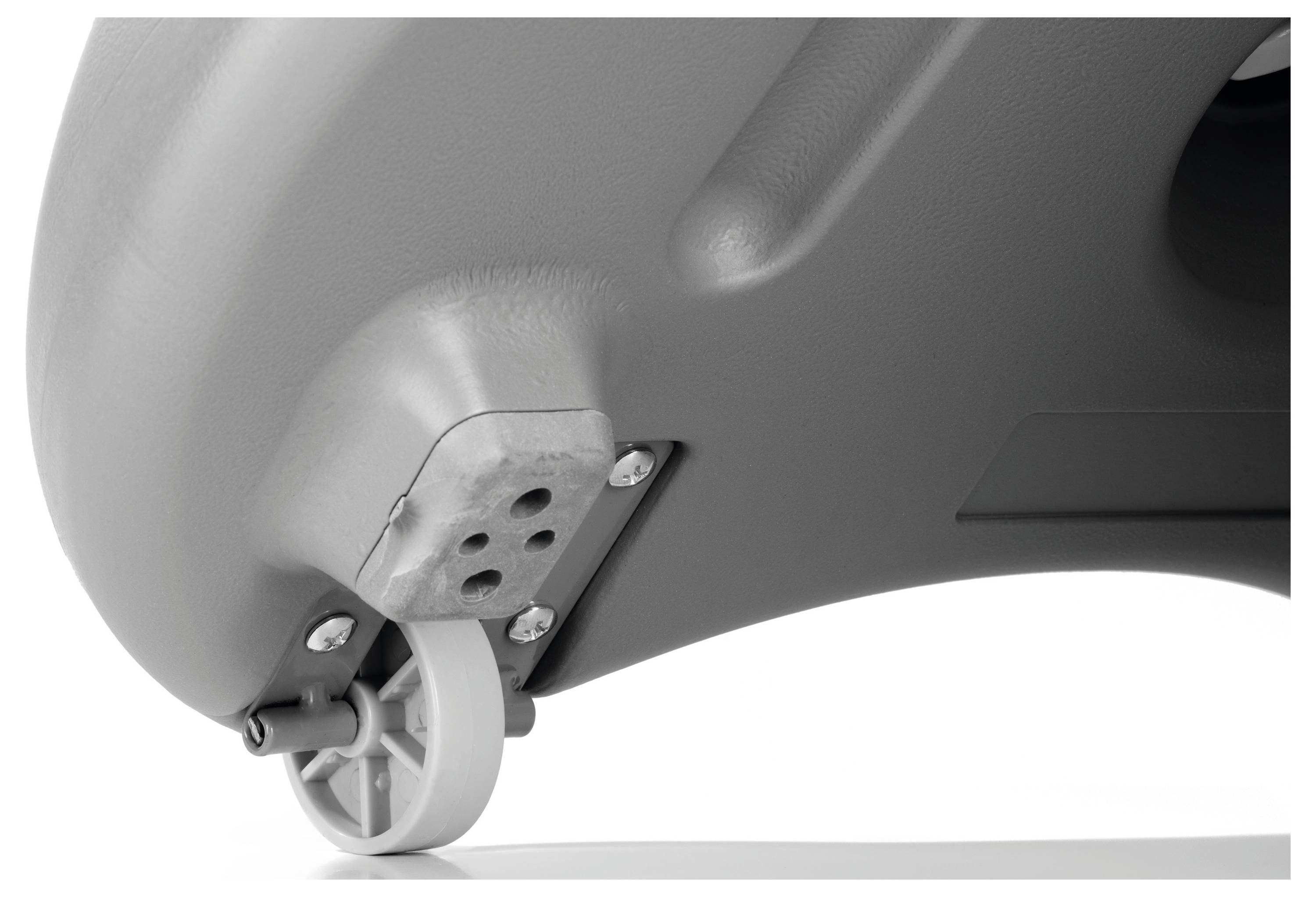 Das Bild zeigt eine Nahaufnahme eines grauen Kunststoffobjekts mit einem kleinen Laufrad, das an der Unterseite angebracht ist, und hebt seine Mobilitätsfunktion hervor.