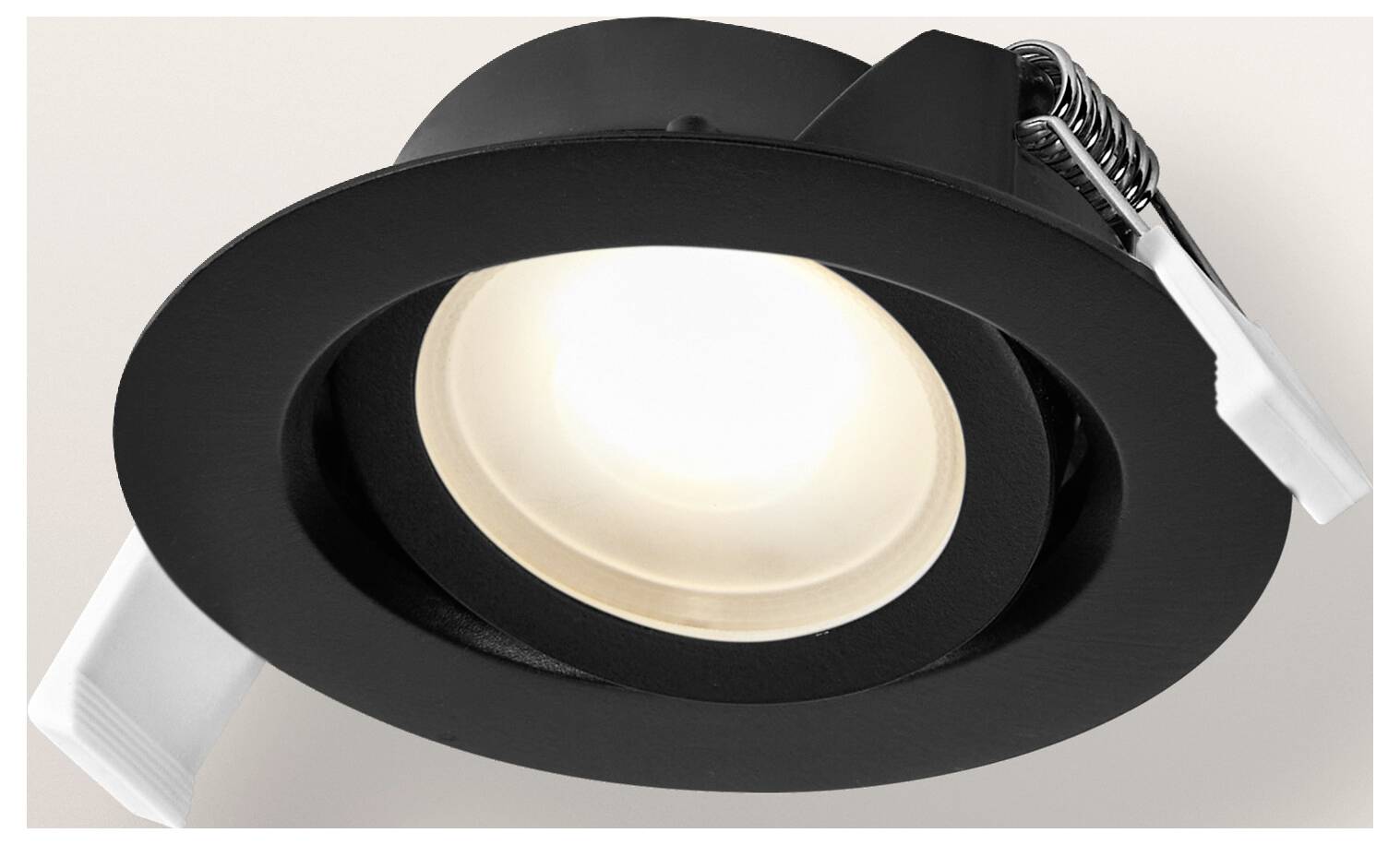 Schwarze, eingelassene Deckenleuchte mit rundem, verstellbarem Ringdesign, das ein weiches weißes Licht ausstrahlt.