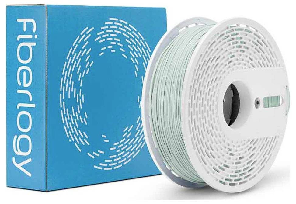 Eine Spule mit hellem minzgrünem 3D-Druckfilament neben einer blauen Fiberlogy-Box mit Markenname und kreisförmigem Logo.