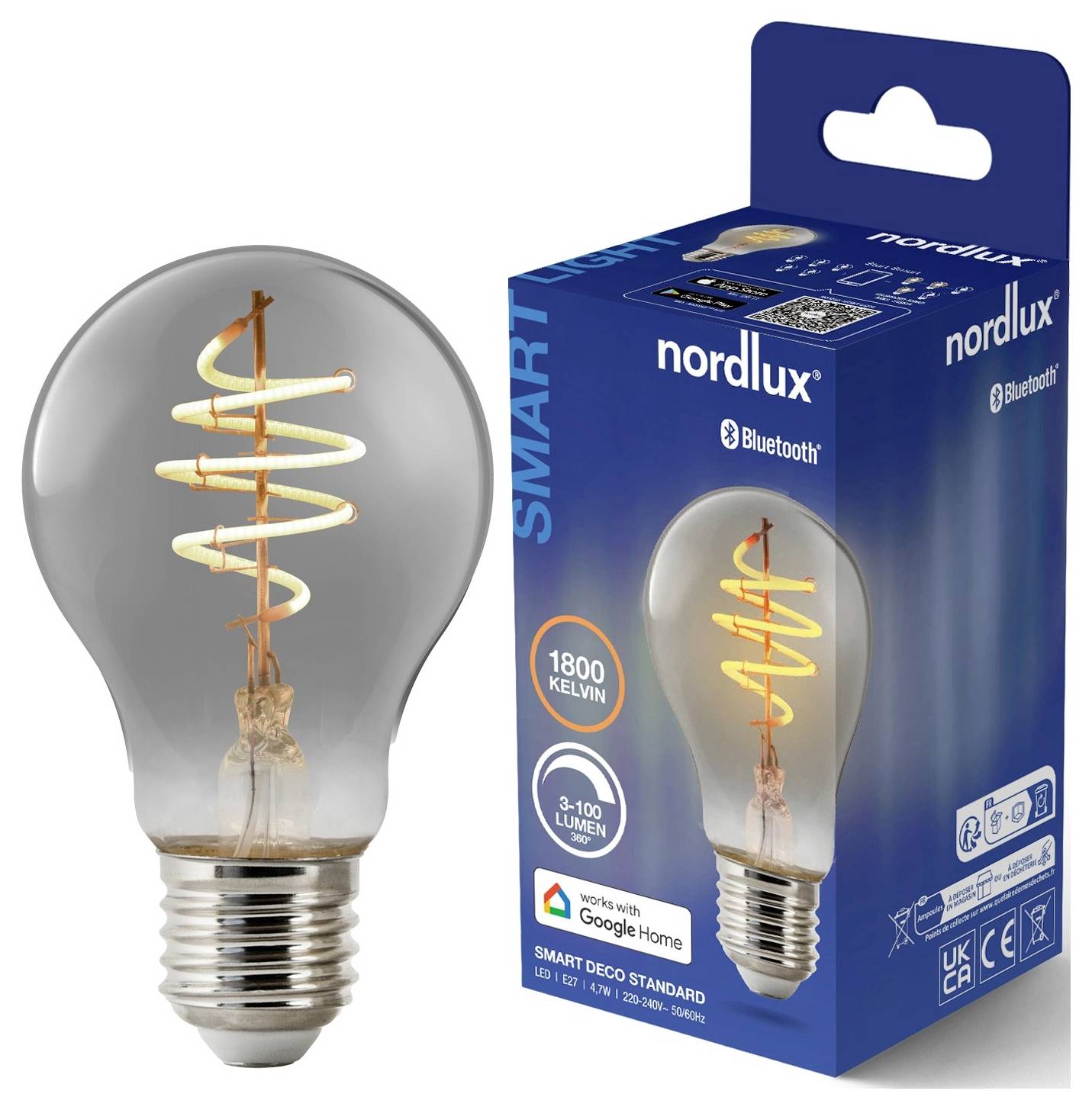 Eine Nordlux Smart-LED-Glühbirne neben der Verpackung. Die Glühbirne ist mit Google Home kompatibel und bietet eine Farbtemperatur von 1800 Kelvin.