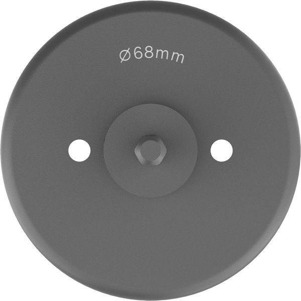 Ein runder, grauer Kunststoffdeckel mit der Aufschrift 