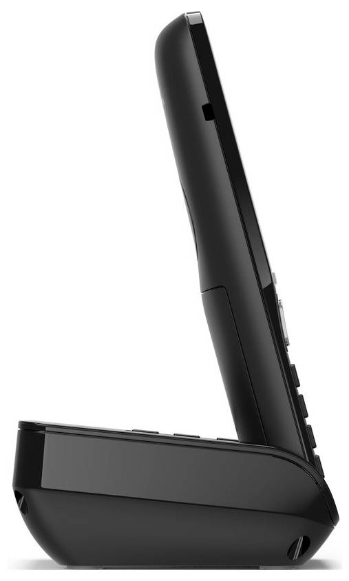 Ein schnurloses Telefon, das in einer Ladestation ruht, von der Seite betrachtet, das sein elegantes schwarzes Design zur Schau stellt.