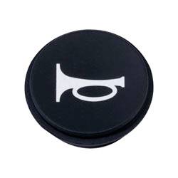 Ein runder schwarzer Knopf mit einem weißen Hornsymbol, häufig in einem Autohupe zu finden.