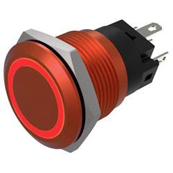 Nahaufnahme eines roten, kreisförmigen Druckschalters mit metallischem Rand und sichtbaren Anschlüssen, entwickelt für elektronische Geräte.