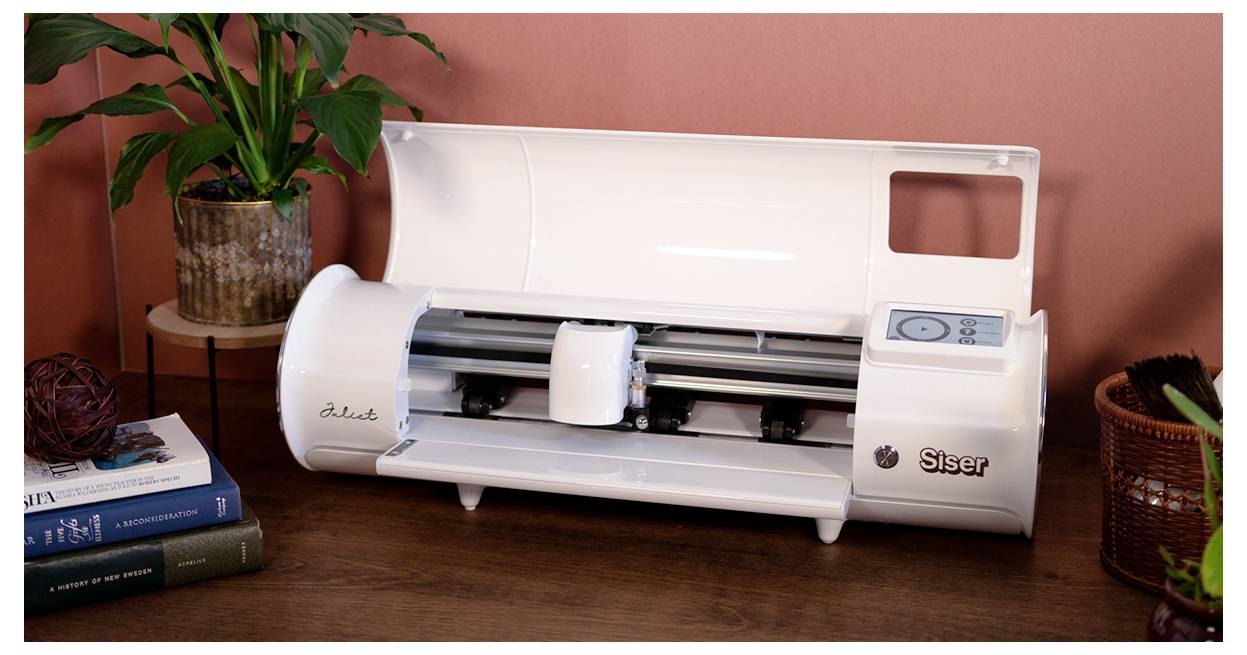 Eine weiße elektronische Schneidemaschine mit der Bezeichnung 