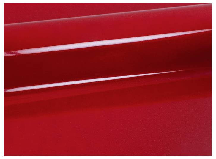 Eine glatte, glänzende rote Oberfläche mit einem etwas dunkleren roten Schatten und Lichtreflektion, die einen abstrakten visuellen Effekt erzeugt.