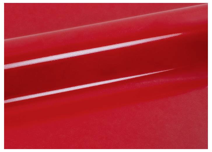 Eine glänzend rote Oberfläche mit reflexivem Glanz, die eine glatte und elegante Textur zeigt.
