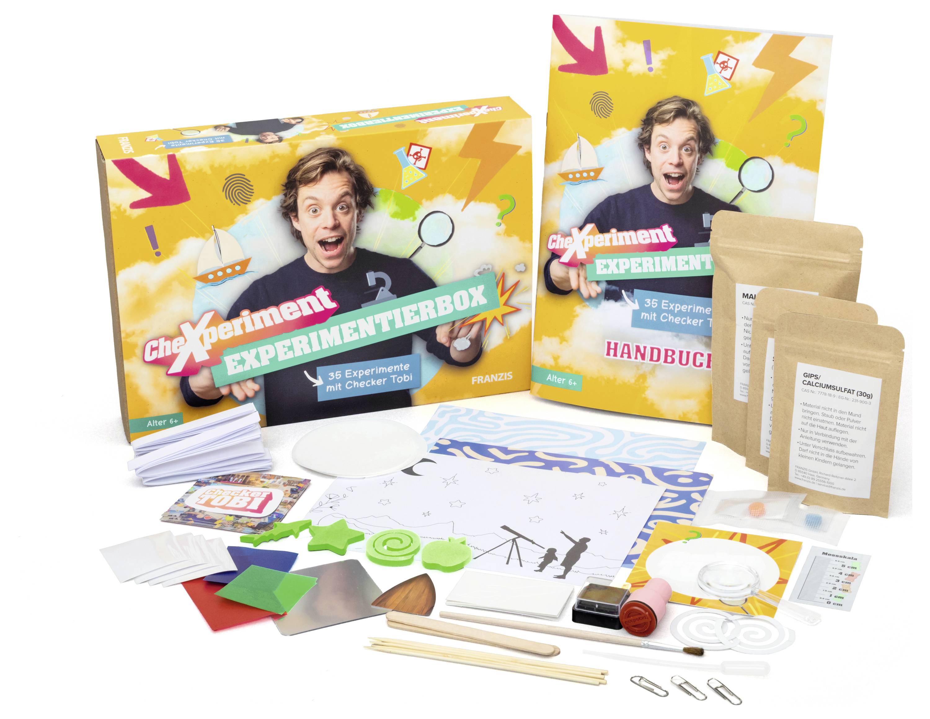Ein Wissenschaftsexperimentierkasten mit verschiedenen farbigen Materialien und einer Anleitung, entworfen für Bildungszwecke und mit 36 Experimenten.