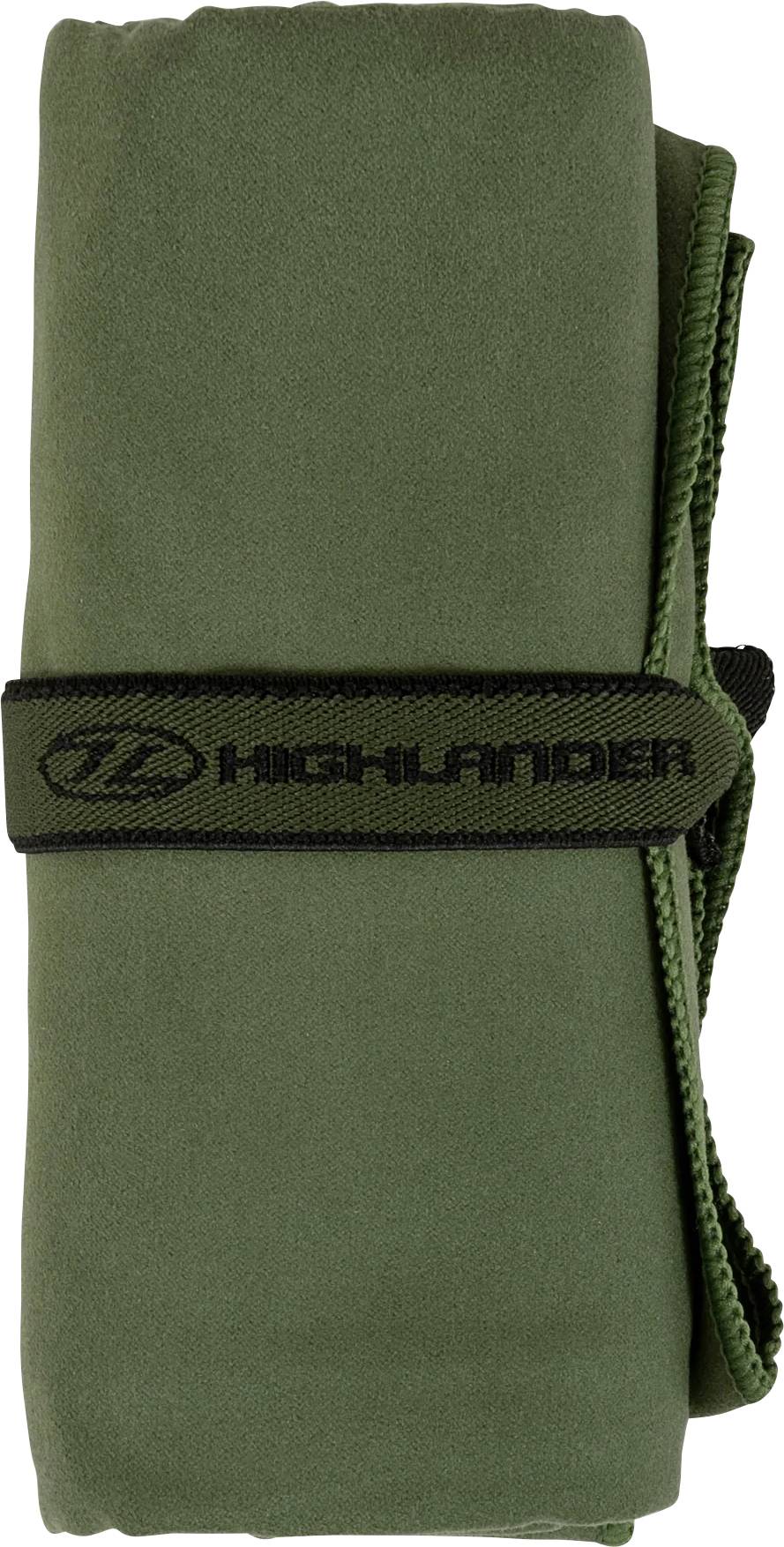 Ein aufgerolltes grünes Handtuch, das mit einem schwarzen Riemen mit der Aufschrift „Highlander