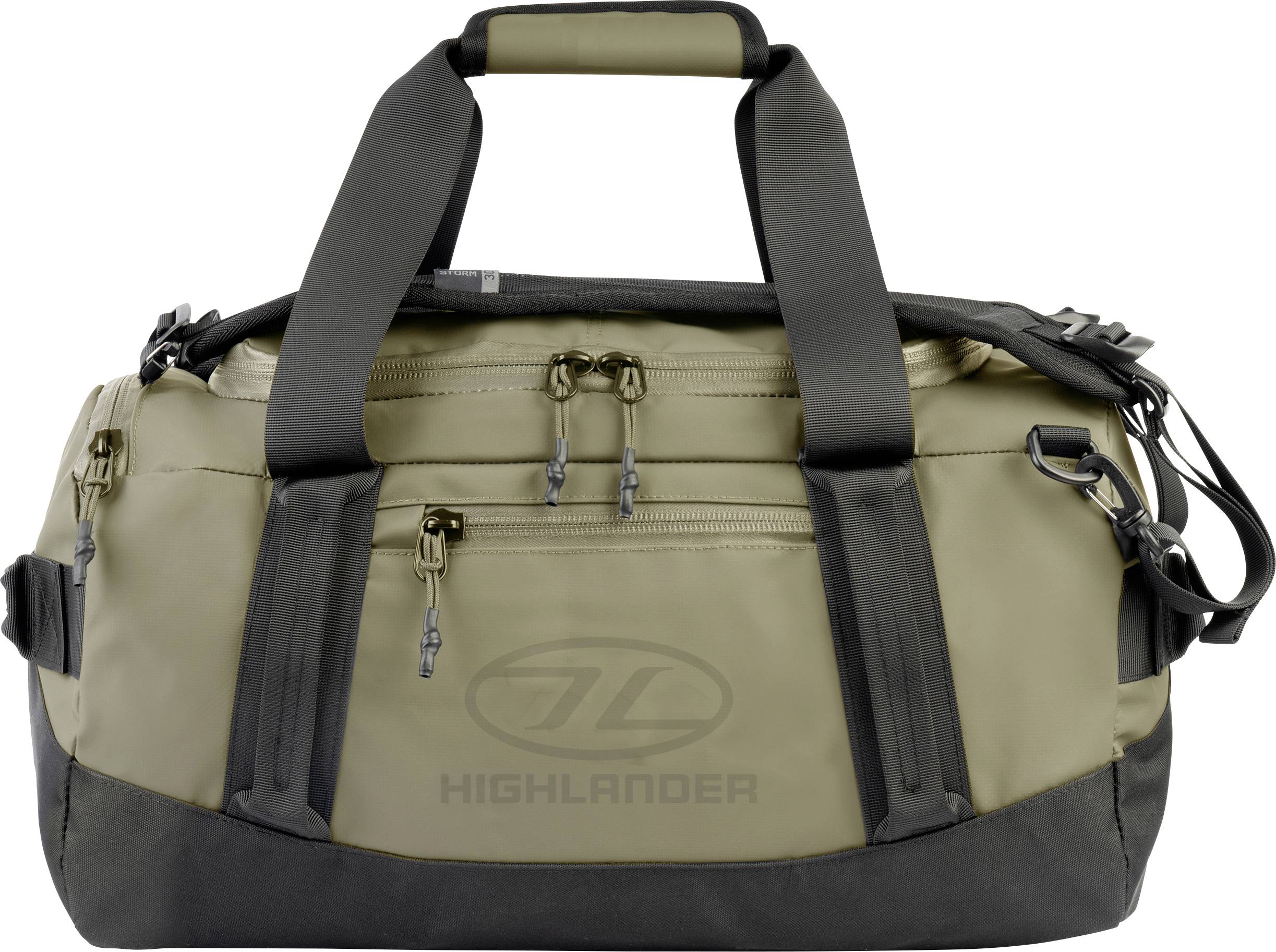 Eine beige und schwarze Reisetasche mit mehreren Reißverschlüssen und Griffen, mit dem 