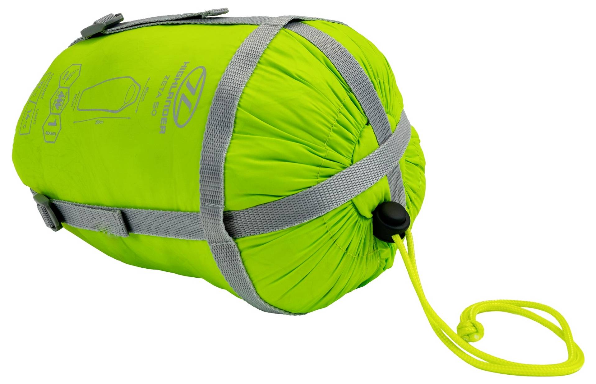 Grüner Schlafsack eng gepackt mit grauen Riemen und einer gelben Zugschnur, mit aufgedruckten Anweisungen auf der Seite.