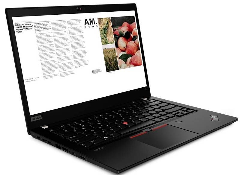 Schwarzer Lenovo-Laptop, offen in einem Winkel dargestellt, auf dem Bildschirm eine Magazinseite mit Text und Fotos von Früchten.