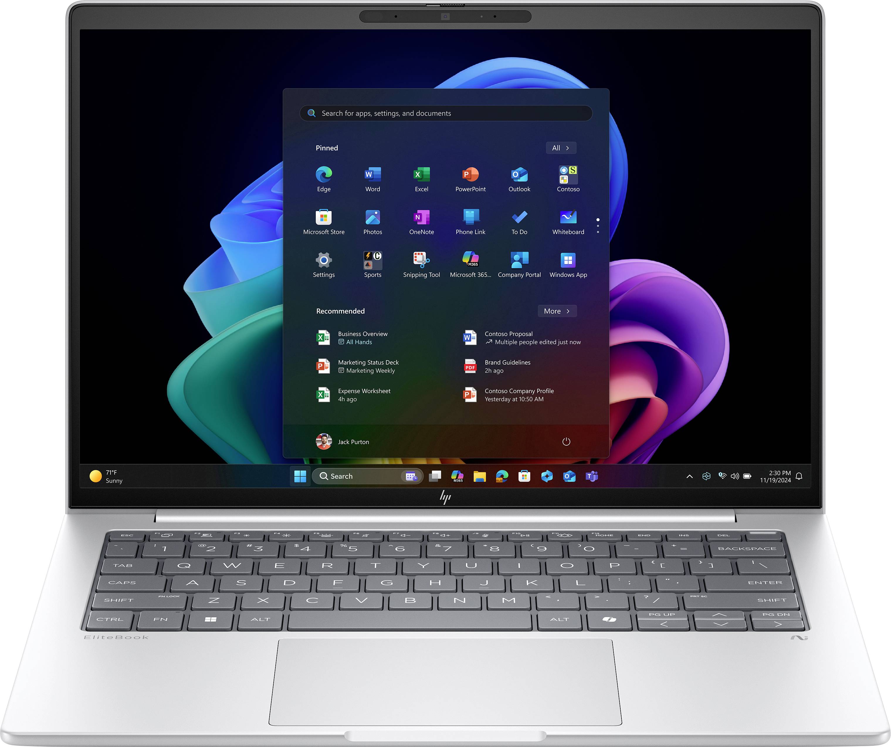 Ein Laptop-Bildschirm zeigt das Windows-11-Startmenü mit App-Symbolen und Verknüpfungen vor einem farbenfrohen abstrakten Hintergrund.