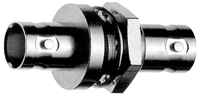 Black-and-white photo of a metal pipe coupling or connector with two cylindrical ends and a central hex nut.