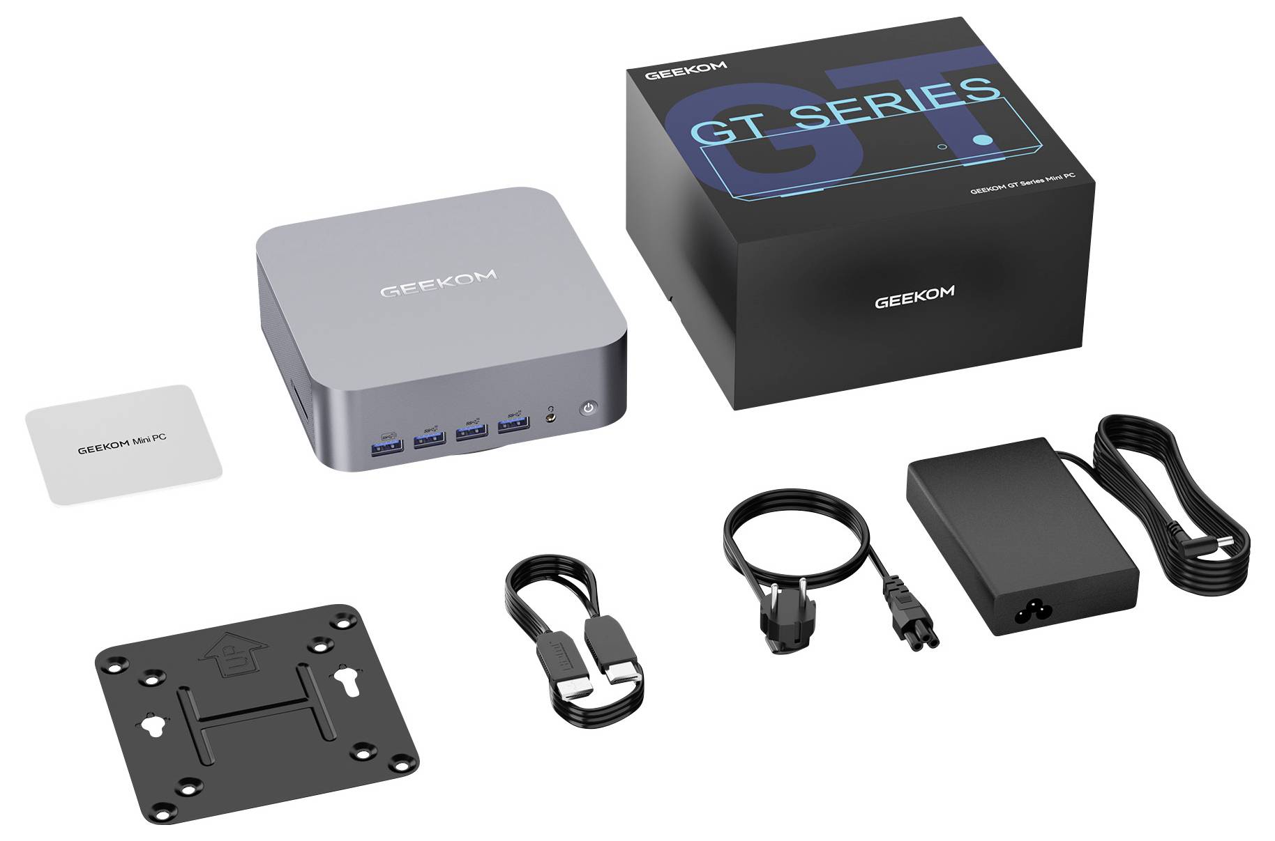 Geekcom GT Series Mini-PC-Set mit dem kompakten Computer, Markenschachtel, Montageplatte, Netzteil, Stromkabel und HDMI-/USB-Zubehör.