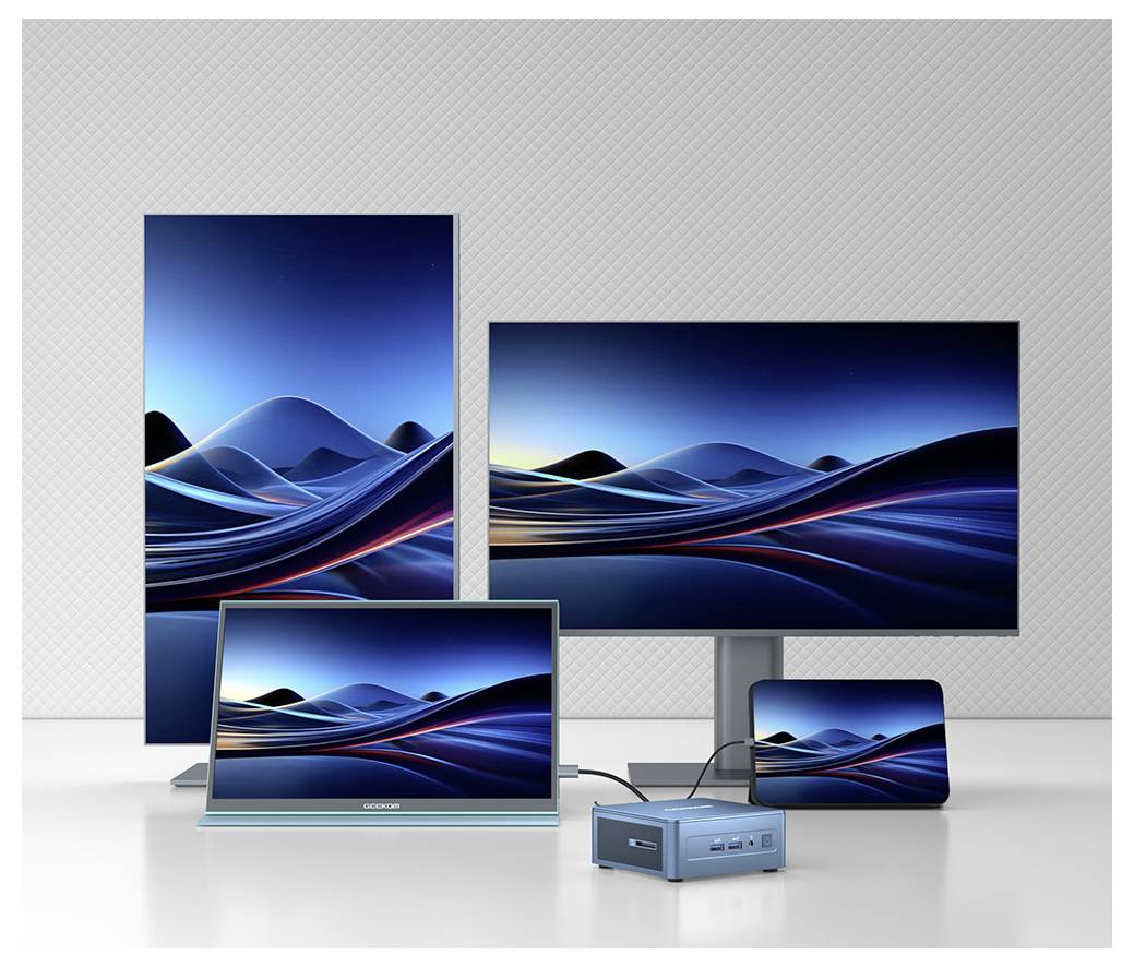 # Multi-Geräte-Display-Setup mit derselben abstrakten blauen Wellen-Hintergrundbilder auf einem vertikalen Monitor, horizontalen Monitor, Laptop und kleinem Tablet/Telefon mit Mini-Desktop-Hub davor.