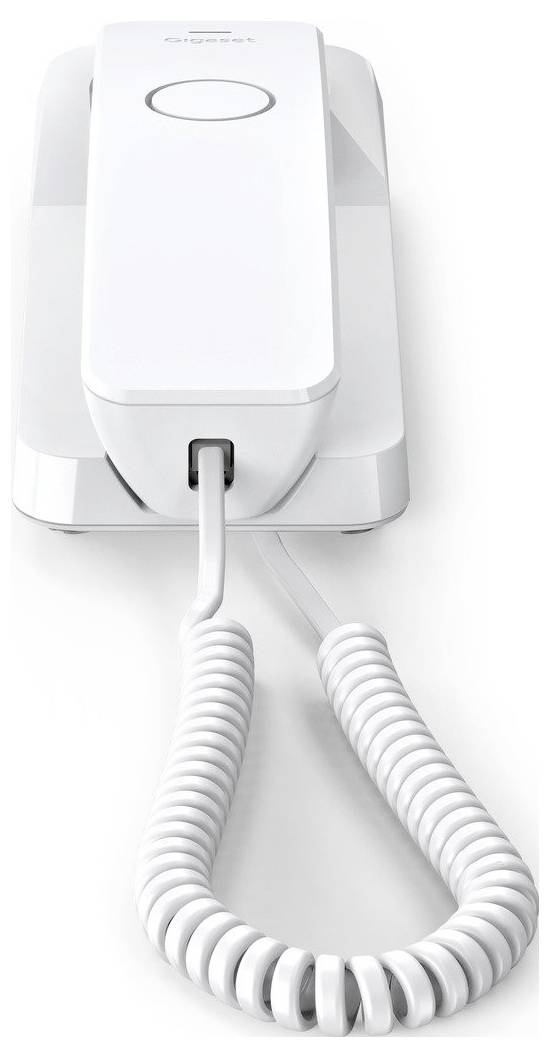 Ein weißes Schnurtelefon mit gewickeltem Kabel, das in seiner Basis ruht, aus einem niedrigen Winkel betrachtet.
