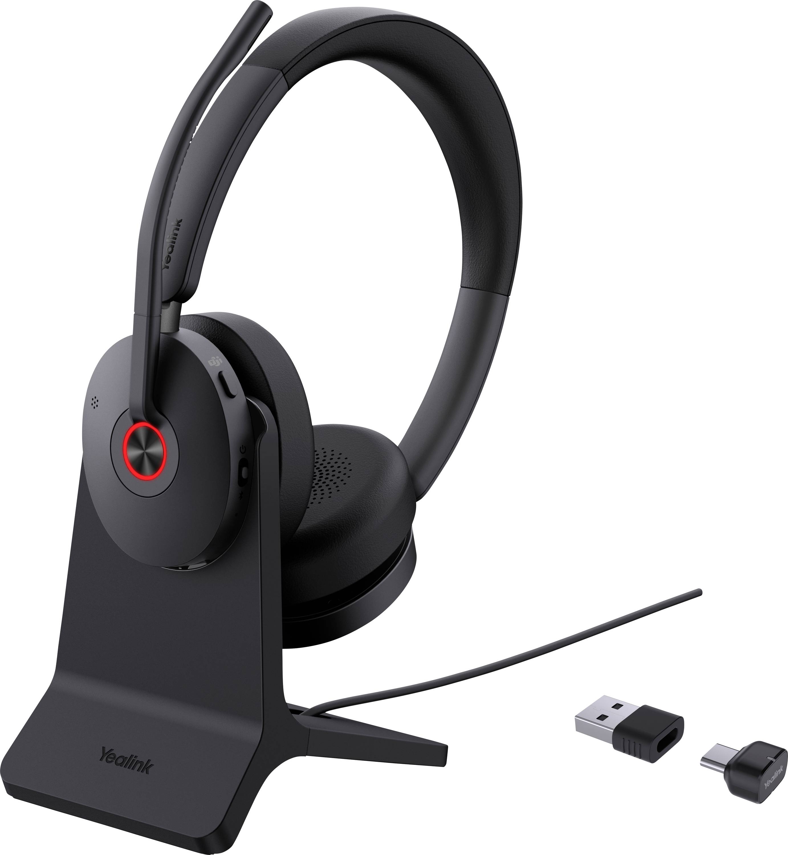 Kabelloses Headset auf Ladeständer mit USB-Dongle und Adapter.