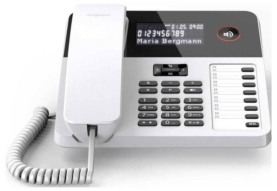 Ein schnurgebundenes Bürotelefon mit digitaler Anzeige, die "0123456789 Maria Bergmann" zeigt, eine Tastatur und eine Lautstärkeregelungstaste.