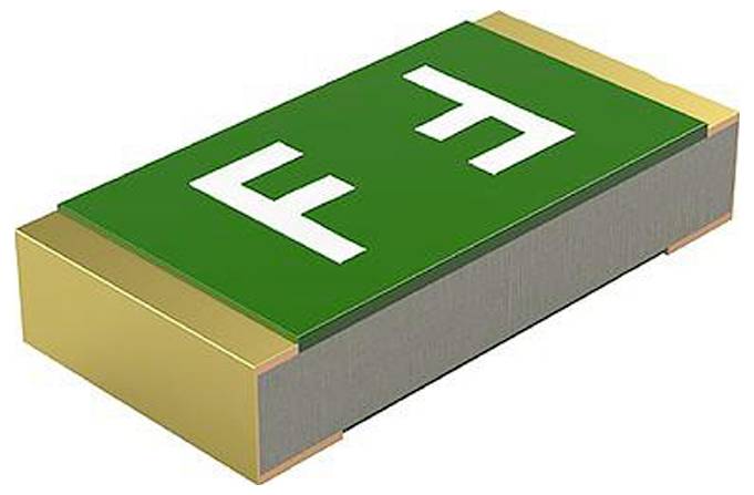 Eine grüne und goldene elektronische Komponente, die einem Widerstand oder Kondensator ähnelt, mit weißen Markierungen 