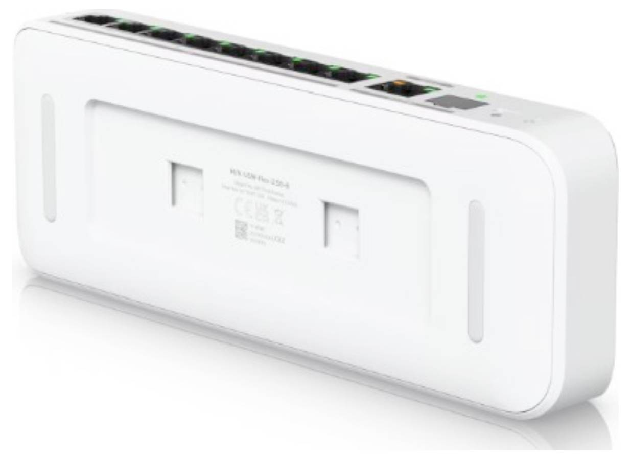 Ein weißer Netzwerk-Switch mit mehreren Ethernet-Anschlüssen und Anzeigelichtern, von hinten fotografiert. Zur Wandmontage konzipiert, mit sichtbaren Montageschlitzen.