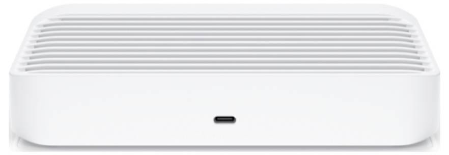 Ein weißes rechteckiges elektronisches Gerät mit einem USB-C-Anschluss an der Vorderseite und Lüftungsgittern auf der Oberseite, wahrscheinlich eine externe Festplatte oder Digitalspeichereinheit.