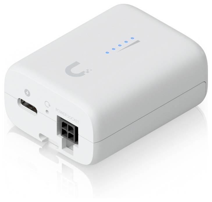 Ein kleines weißes elektronisches Gerät mit einem USB-Anschluss, einer Stromsteckdose und Anzeigelichtern oben, die fünf blaue Punkte zeigen, um die Ladestatus anzuzeigen.