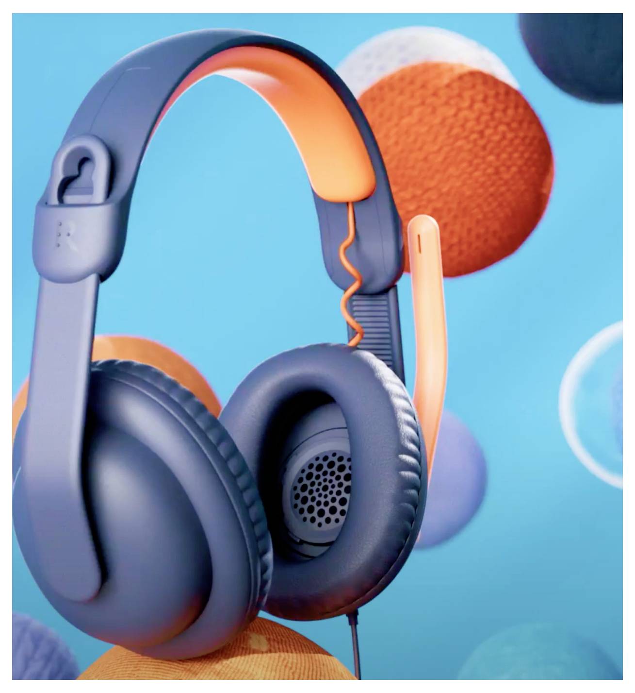 Schwarze Over-Ear-Kopfhörer mit orangefarbenen Akzenten vor einem leuchtend blauen Hintergrund mit schwebenden bunten Kugeln.