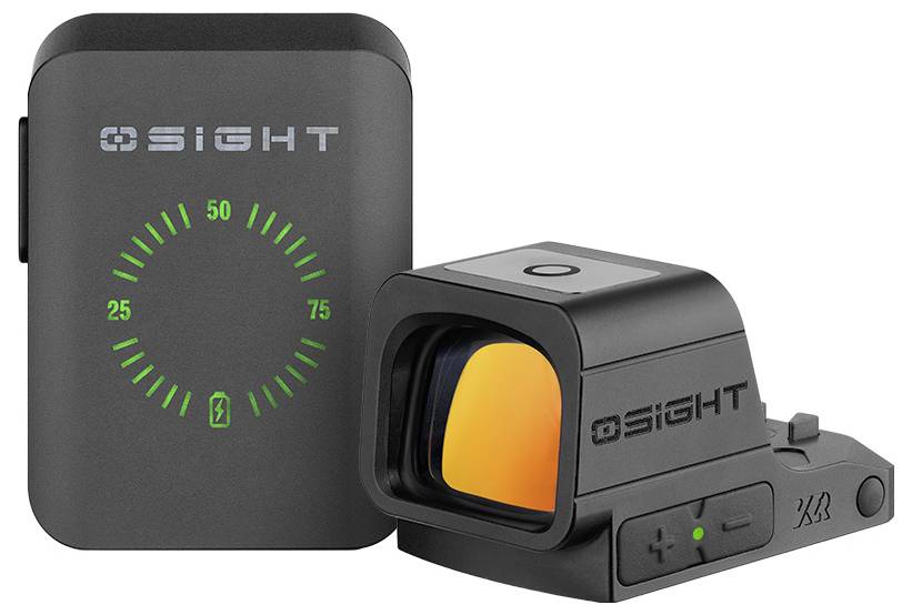 Ein schwarzes elektronisches Gerät mit einem Bildschirm, auf dem ein grüner Halbkreis angezeigt wird, und eine schwarze Visiervorrichtung mit einem orange getönten Objektiv.