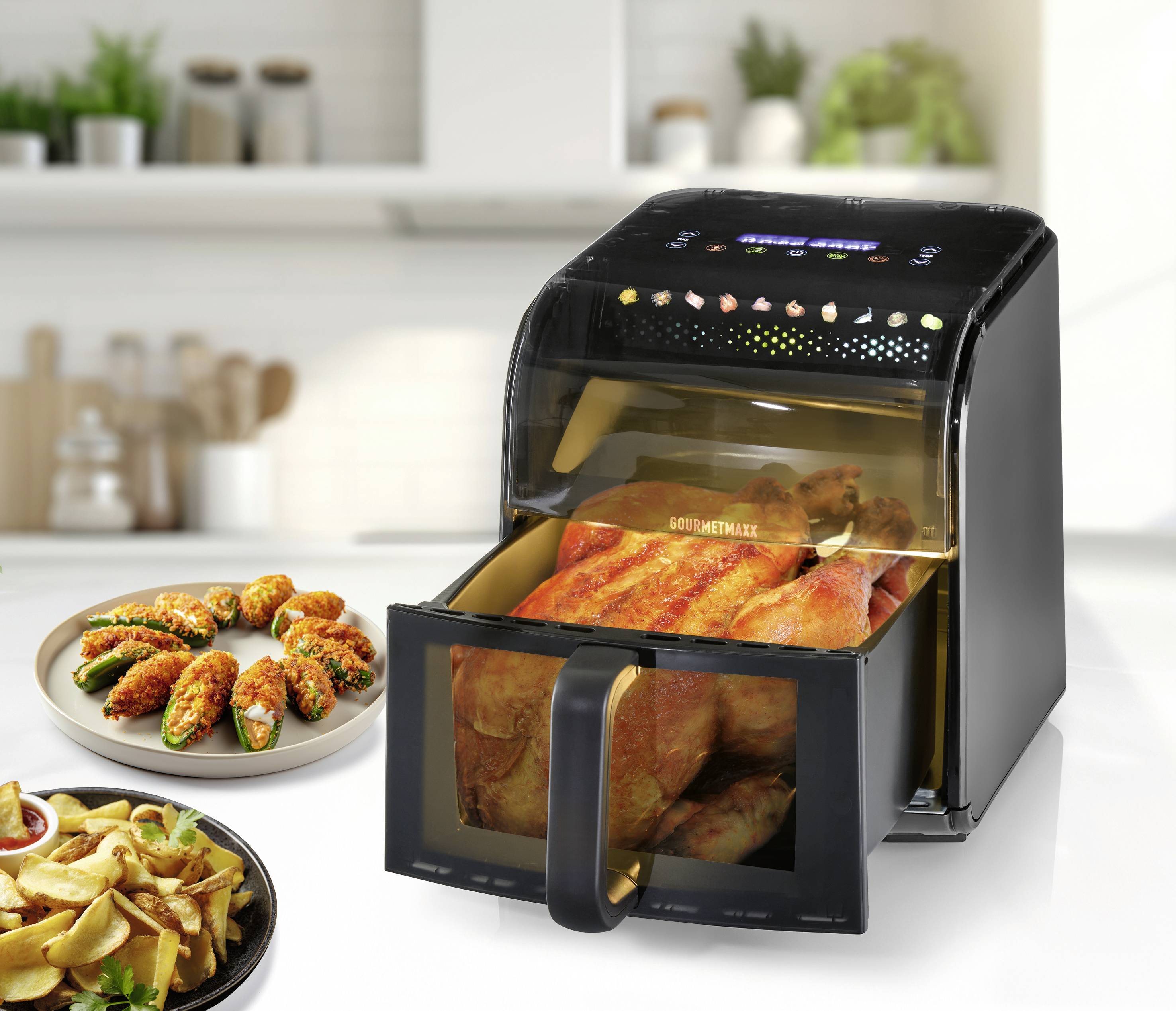 Elektrofritteusenofen mit transparenter Frontscheibe, in der ein gares ganzes Hähnchen zu sehen ist; Bedienfeld oben mit Kochsymbolen.