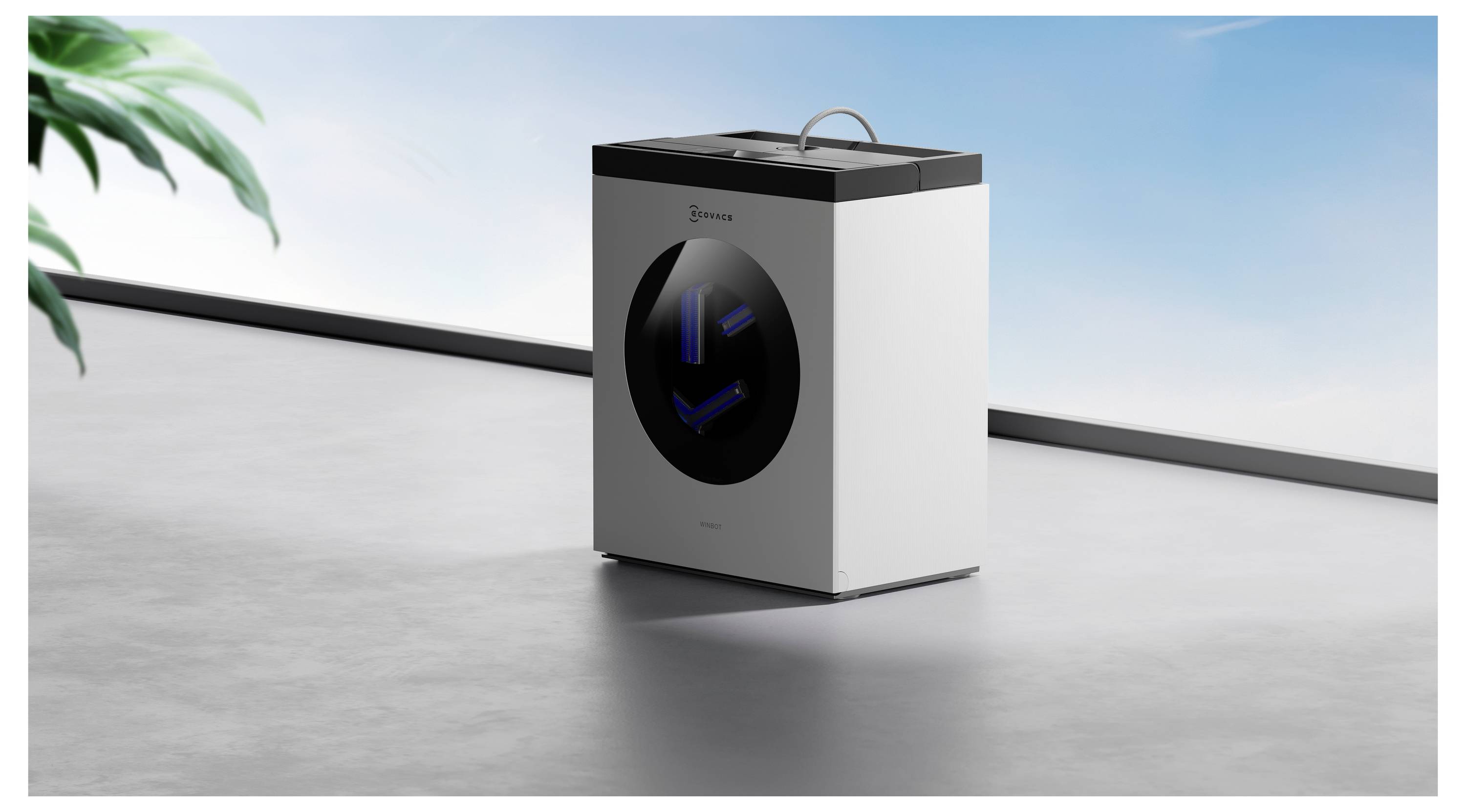 Eine moderne, würfelförmige Waschmaschine mit elegantem schwarz-weißem Design steht auf einer minimalistischen Oberfläche vor einem leuchtend blauen Himmelshintergrund.